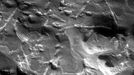 Magnified Look at a Meteorite on Mars NASA's Mars Exploration Rover Opportunity used its microscopic imager to get this view of the surface of a rock called "Block Island" during the 1,963rd Martian day, or sol, of the rover's mission on Mars (Aug. 1, 2009). The triangular pattern of small ridges seen at the upper right in this image and elsewhere on the rock is characteristic of iron-nickel meteorites found on Earth, especially after they have been cut, polished and etched. Block Island has been identified as an iron-nickel meteorite based on this surface texture and analysis of its composition by Opportunity's alpha particle X-ray spectrometer. At about 60 centimeters (2 feet) across, it is the largest meteorite yet found on Mars. This image shows a patch 32 millimeters by 32 millimeters (1.3 inches by 1.3 inches) on the surface of Block Island while the target was fully illuminated by the sun. This target on the rock is informally named "New Shoreham." The vertical white streaks, especially near the top and bottom of the image, are artifacts caused by saturation of the camera's CCD (charge-coupled device, or image recorder) where sunlight glinted off metallic facets. The triangular pattern in the texture of iron-nickel meteorites, called the Widmanstatten pattern, formed more than 4.5 billion years ago as the metal cooled. One iron-nickel mineral, kamacite, formed thin layers along the surface of crystals of another, taenite, which contains less nickel. The two minerals differ in their resistance to either etching by acid or erosion by wind-blown sand, so those processes can make the pattern visible. Image Credit: NASA/JPL-Caltech/Cornell University/USGS