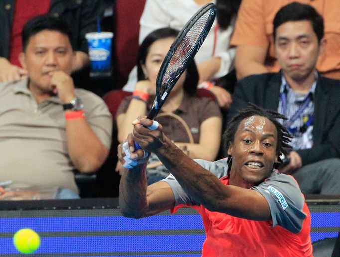 Gael Monfils of the Indian Aces returns a shot to Marin Cilic of the UAE Royals during their men's single match at the International Premier Tennis League (IPTL) in Manil