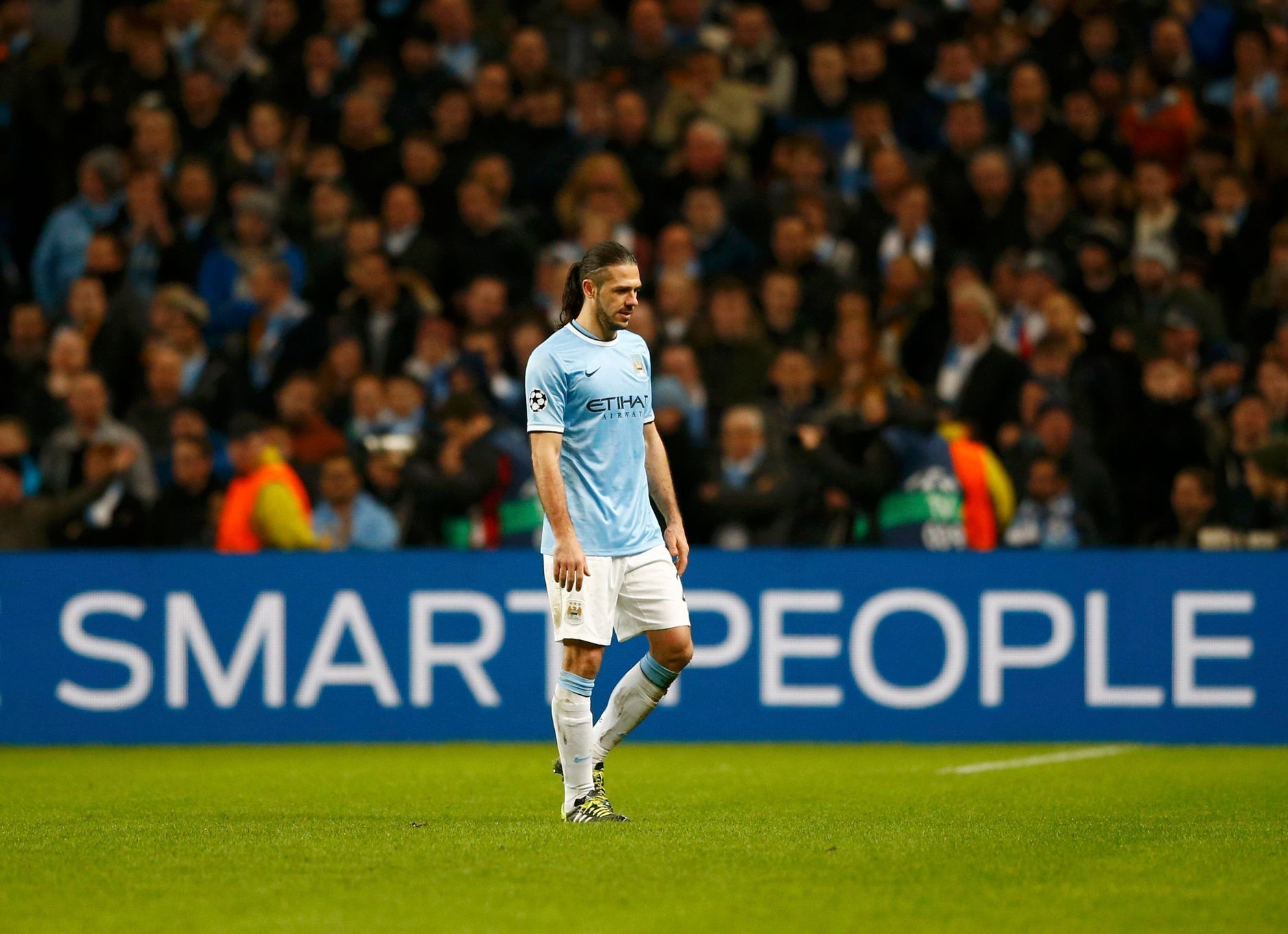 Manchester City's Martin Demichelis walks off after being shown the red card during their Champions League round of 16 first leg soccer match against Barcelona at the Etihad Stadium in Manchester