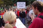 Jan Líska from the People in Need foundation reads the text of the petition to the assembled crowd