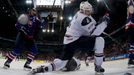 Slovakia's Michal Sersen (L) celebrates their goal next to Team USA's Jamie McBain during their 2013 IIHF Ice Hockey World Championship preliminary round match at the Har