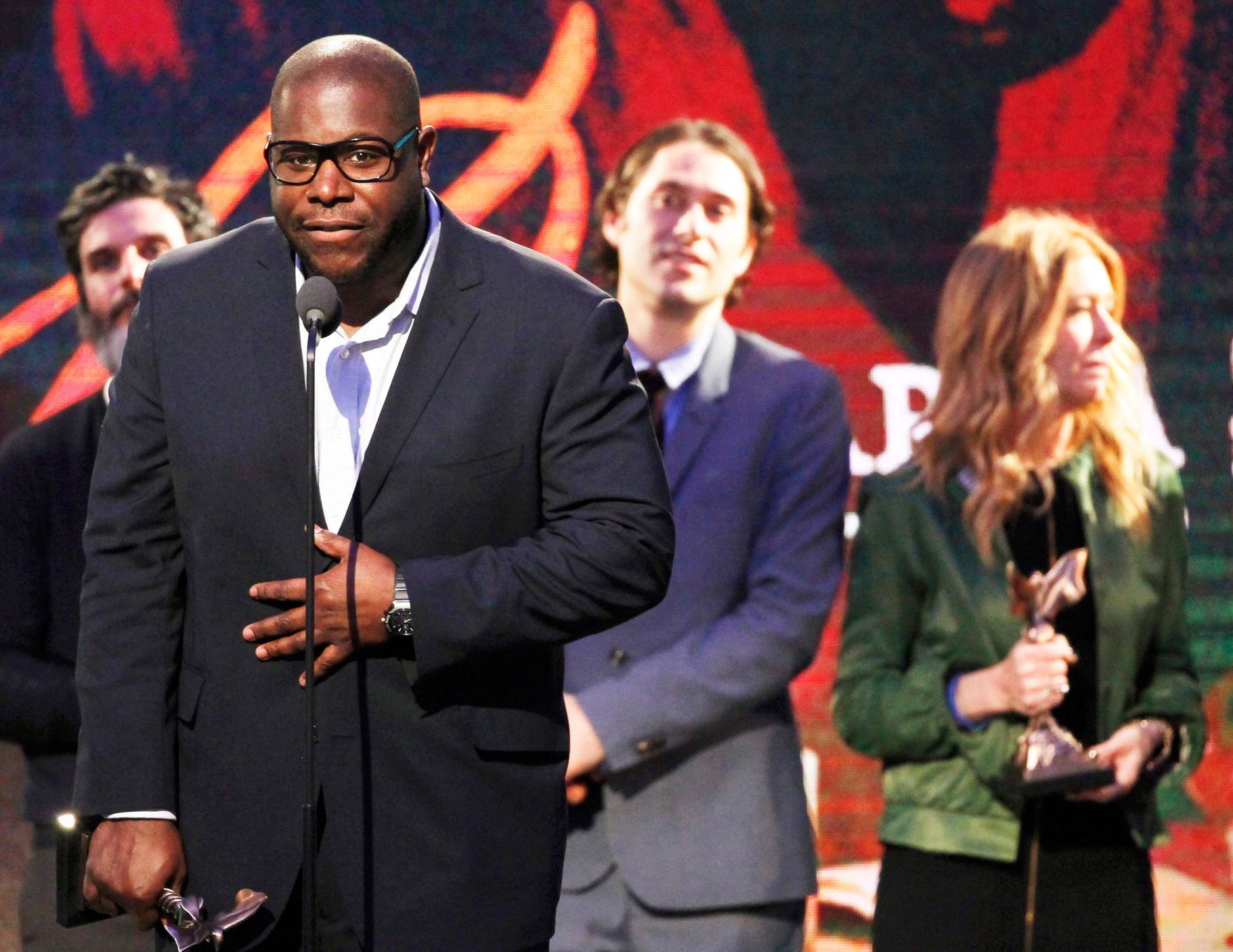 Director Steve McQueen accepts the best feature award for the film &quot;12 Years a Slave&quot; at the 2014 Film Independent Spirit Awards in Santa Monica