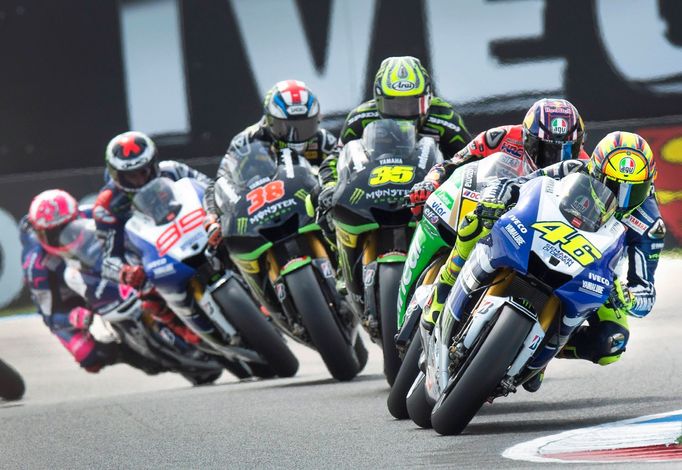 Yamaha MotoGP rider Valentino Rossi of Italy (R) takes a curve during the Dutch Grand Prix in Assen June 29, 2013. REUTERS/Paul Vreeker/United Photos (NETHERLANDS - Tags: