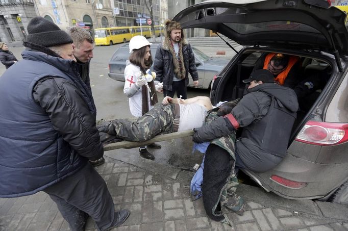 ATTENTION EDITORS - VISUAL COVERAGE OF SCENES OF INJURY OR DEATH - A wounded protester is rushed in a vehicle following violence in Independence Square in Kiev February 2