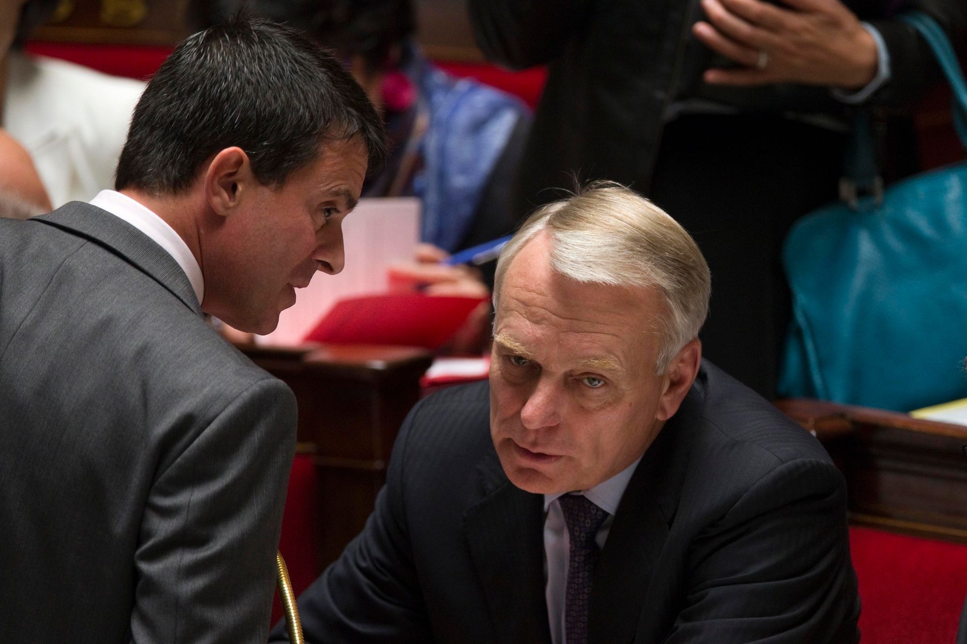File picture of French Interior Minister Valls talking with Prime Minister Ayrault before the questions to the government session at the National Assembly in Paris