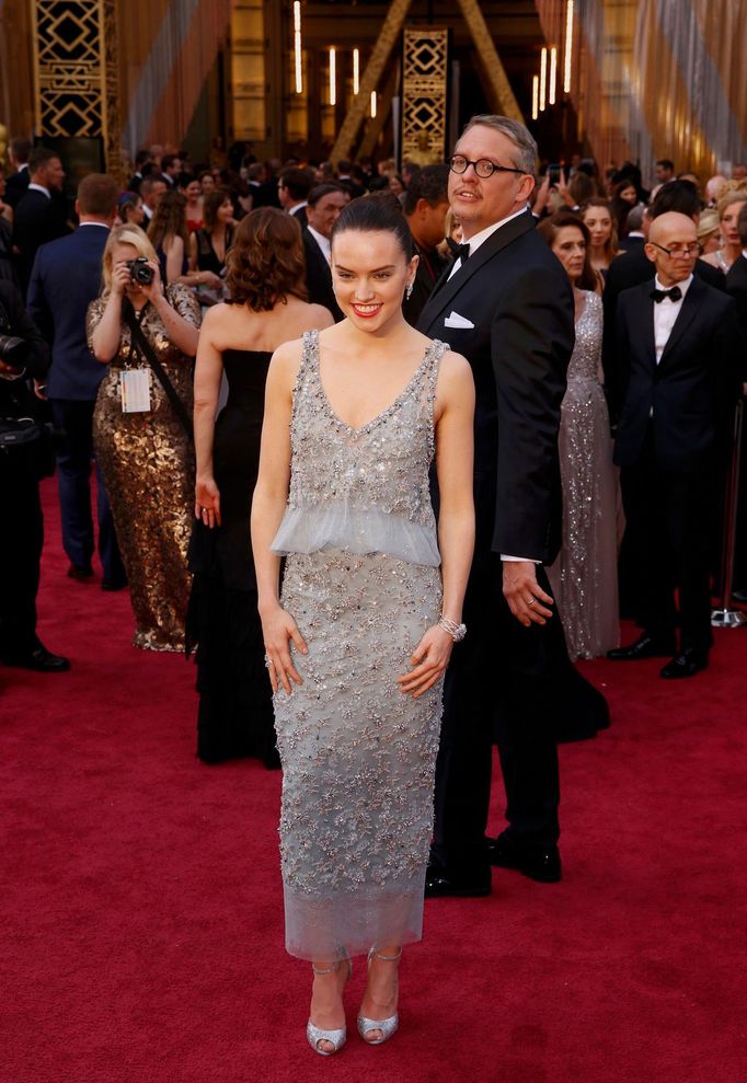 Presenter Daisy Ridley, wearing Chanel, poses on the red carpet at the 88th Academy Awards in Hollywood, California