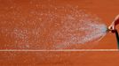 Tennis - French Open - Roland Garros, Paris, France - June 1, 2019. A crew member sprays the court. REUTERS/Vincent Kessler     TPX IMAGES OF THE DAY