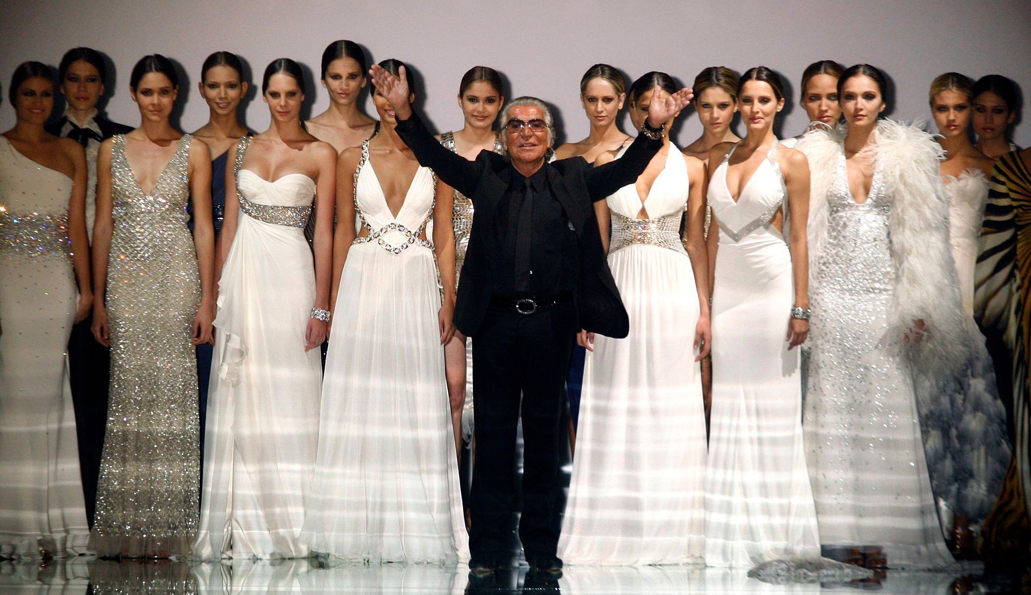 File photo shows Italian designer Roberto Cavalli acknowledging the crowd after models presented his collection during the Cali Exposhow in Cali