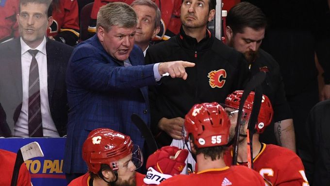 Apr 13, 2019; Calgary, Alberta, CAN; Calgary Flames head coach Bill Peters speaks to his team during the third period against the Colorado Avalanche in game two of the fi