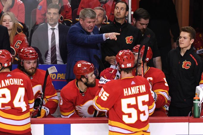 Apr 13, 2019; Calgary, Alberta, CAN; Calgary Flames head coach Bill Peters speaks to his team during the third period against the Colorado Avalanche in game two of the fi