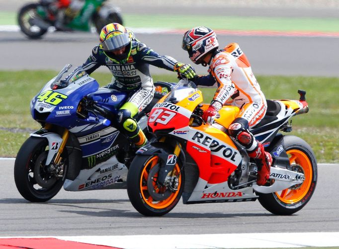 Yamaha MotoGP rider Valentino Rossi of Italy is congratulated by Honda rider Marc Marquez (R) after winning the Dutch Grand Prix in Assen June 29, 2013. REUTERS/Michael K