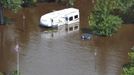 Severely flooded areas of Fond du Lac, Minnesota are seen in this June 24, 2012, U.S. Coast Guard aerial handout photograph, made available on June 25. Duluth officials on Thursday estimated damage at up to $80 million just to the city's public infrastructure from the flood that swamped the northeast Minnesota city and nearby communities this week. The flooding, which left huge sinkholes and ripped up dozens of roads, also forced hundreds of people from their homes and killed several zoo animals. Picture taken June 24, 2012. REUTERS/Matthew Schofield/U.S. Coast Guard photo/Handout (UNITED STATES - Tags: DISASTER ENVIRONMENT TPX IMAGES OF THE DAY) FOR EDITORIAL USE ONLY. NOT FOR SALE FOR MARKETING OR ADVERTISING CAMPAIGNS. THIS IMAGE HAS BEEN SUPPLIED BY A THIRD PARTY. IT IS DISTRIBUTED, EXACTLY AS RECEIVED BY REUTERS, AS A SERVICE TO CLIENTS Published: Čer. 25, 2012, 2:57 odp.