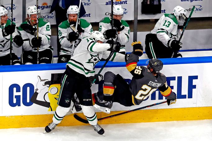 Sep 6, 2020; Edmonton, Alberta, CAN; Dallas Stars center Radek Faksa (12) checks Vegas Golden Knights center Paul Stastny (26) during the first period in game one of the