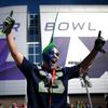 A Seattle Seahawks fan celebrates while awaiting the start of the NFL Super Bowl XLIX football game against the New England Patriots in Glendale