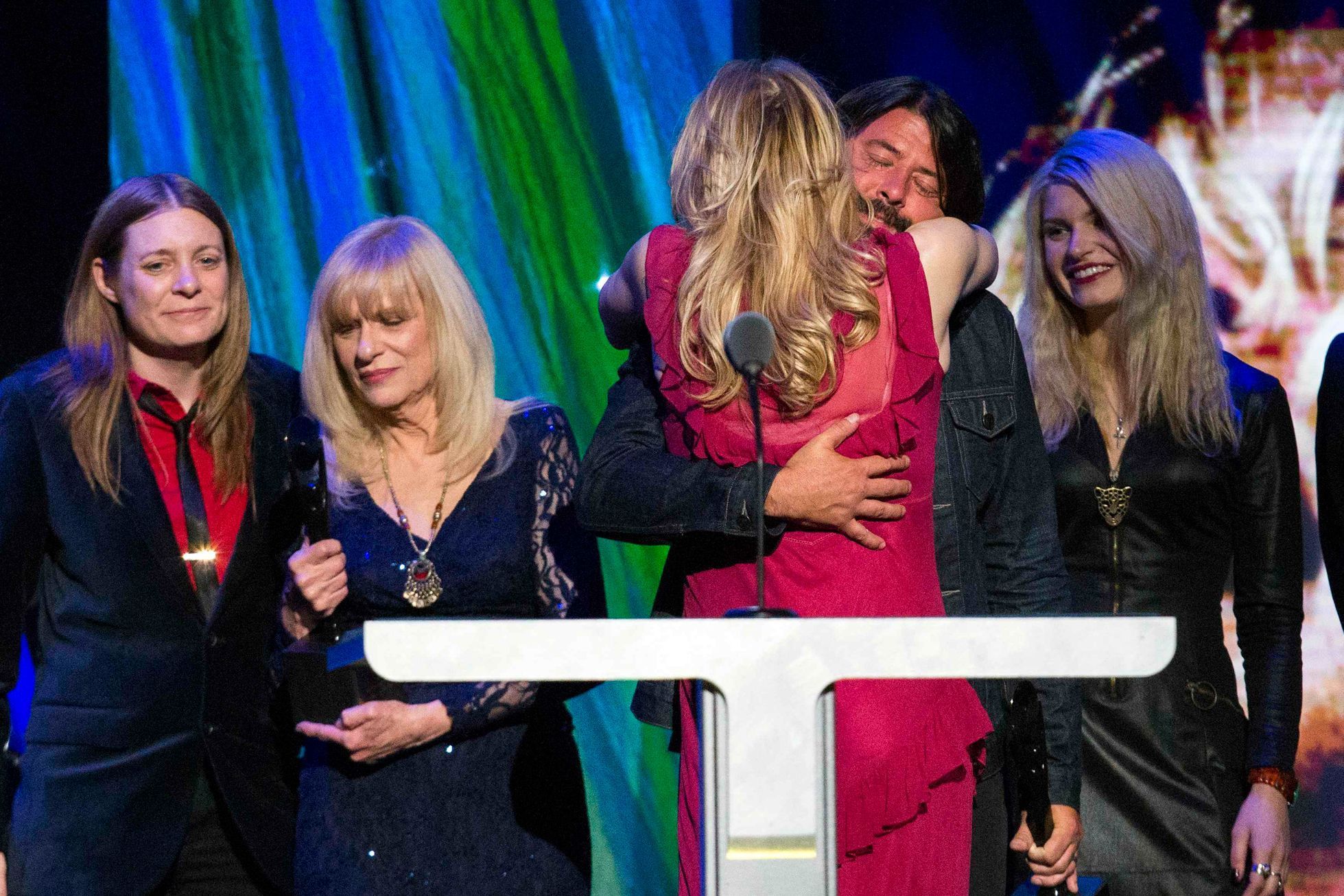 Love hugs drummer Grohl of Nirvana after the band was inducted during 29th annual Rock and Roll Hall of Fame Induction Ceremony in Brooklyn, New York