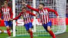 Yannick Ferreira Carrasco celebrates with Antoine Griezmann (C) and Fernando Torres (L) after scoring the first goal for Atletico Madrid