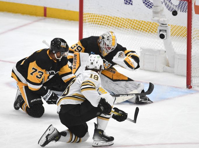 Apr 13, 2024; Pittsburgh, Pennsylvania, USA; Boston Bruins center center Pavel Zacha (18) scores on Pittsburgh Penguins goalie Alex Nedeljkovic (39) during the second per