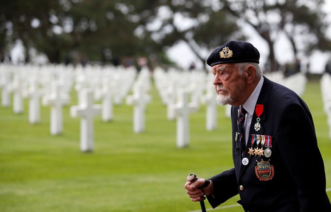 British D-Day veteran Richard Llewellyn arrives for a ceremony at Normandy American Cemetery and Memorial situated above Omaha Beach