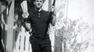 Lee Harvey Oswald, accused of assassinating former U.S. President John F. Kennedy, is pictured holding a rifle in this undated Dallas Police Department Archive image. This photo, described as showing Oswald "holding a rifle in one hand and Communist newspapers in the other" in the backyard of 214 W. Neely Street, is believed to have been taken by his wife Marina Oswald in 1963.