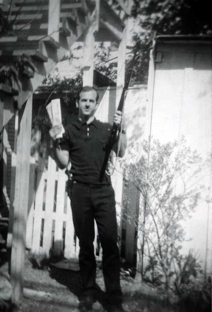 Lee Harvey Oswald, accused of assassinating former U.S. President John F. Kennedy, is pictured holding a rifle in this undated Dallas Police Department Archive image. This photo, described as showing Oswald "holding a rifle in one hand and Communist newspapers in the other" in the backyard of 214 W. Neely Street, is believed to have been taken by his wife Marina Oswald in 1963.