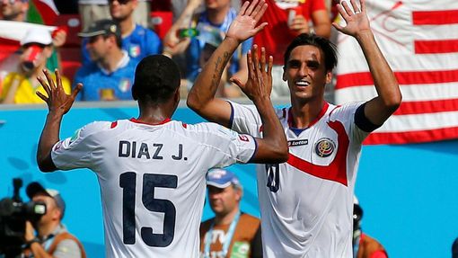 Costa Rica's Bryan Ruiz celebrates with Junior Diaz after scoring a goal during the 2014 World Cup Group D soccer match between Italy and Costa Rica at the Pernambuco are