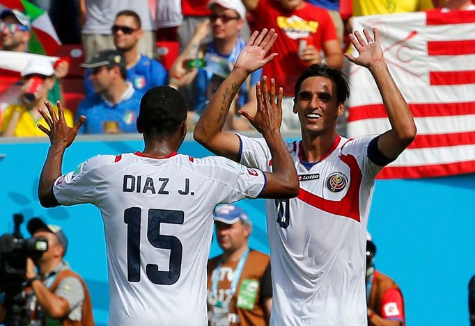 Costa Rica's Bryan Ruiz celebrates with Junior Diaz after scoring a goal during the 2014 World Cup Group D soccer match between Italy and Costa Rica at the Pernambuco are