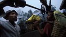 Indonesia Sulphur mine on Ijen Crater Volcano. Workers weight sulphur. Each one carries around 80 to 110 kilos out of the mine, and does two or three trips up and down th