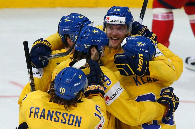 Sweden's Mattias Ekholm (14) celebrates his goal against the Belarus during their men's ice hockey World Championship quarter-final game at Minsk Arena in Minsk May 22, 2