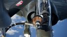 A French military Mirage 2000D fighter plane is refuelled in the air over N'Djamena, Chad, in this photo released by the French Army Communications Audiovisual office (ECPAD) on January 12, 2013. French forces carried out a second day of air strikes against Islamist rebels in Mali on Saturday and sent troops to protect the capital Bamako in an operation involving several hundred soldiers, Defence Minister Jean-Yves Le Drian said. REUTERS/ECPAD/Adj. Nicolas Richard/Handout (CHAD - Tags: POLITICS MILITARY TRANSPORT CIVIL UNREST) NO SALES. NO ARCHIVES. FOR EDITORIAL USE ONLY. NOT FOR SALE FOR MARKETING OR ADVERTISING CAMPAIGNS. THIS IMAGE HAS BEEN SUPPLIED BY A THIRD PARTY. IT IS DISTRIBUTED, EXACTLY AS RECEIVED BY REUTERS, AS A SERVICE TO CLIENTS Published: Led. 12, 2013, 11:23 odp.