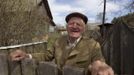 Villager Shamianok poses for picture at his house in abandoned village of Tulgovichi