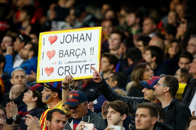 Fans with a banner in tribute to Johan Cruyff before the game