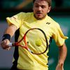 Stan Wawrinka of Switzerland returns a backhand to Guillermo Garcia-Lopez of Spain during their men's singles match at the French Open tennis tournament at the Roland Garros stadium in Paris