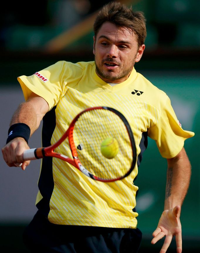 Stan Wawrinka of Switzerland returns a backhand to Guillermo Garcia-Lopez of Spain during their men's singles match at the French Open tennis tournament at the Roland Gar