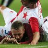 Fotbalista pražské Slavie Milan Nitrianský zalehl Ladislava Krejčího v utkání 9. kola Gambrinus ligy 2012/13 se Spartou.