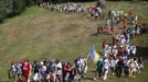 People walk through a forest near the village of Nezuk, about 150 km (93 miles) from capital of Sarajevo, July 8, 2012. Several thousand people on Sunday started a 85 km (53 mile) march from Nezuk to Srebrenica called the "March of Peace", to retrace the route in reverse taken by Bosnian Muslims who fled Serb forces who slaughtered 8,000 of their Muslim kin in 1995. The participants in the march consisted of survivors of the Srebrenica massacre as well as people from all parts of Bosnia and countries around the world. REUTERS/Dado Ruvic (BOSNIA AND HERZEGOVINA - Tags: POLITICS SOCIETY) Published: Čec. 8, 2012, 10:09 dop.