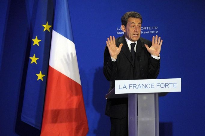 France's President and UMP party candidate for the 2012 French presidential elections Sarkozy delivers a speech at a campaign rally in Saint Maurice