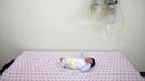 A baby abandoned in a "baby box" at Joosarang church waits for a medical examination at a children's hospital in Seoul September 19, 2012. Pastor Lee Jong-rak of the church, who runs a "baby box" where mothers can leave unwanted infants, has seen a sharp increase in the number of newborns being left there because, the pastor says, of a new law aimed protecting the rights of children. South Korea is trying to shed a reputation of being a source of babies for adoption by people abroad. It is encouraging domestic adoption and tightening up the process of a child's transfer from birth mother to adoptive parents. Picture taken September 19, 2012. REUTERS/Kim Hong-Ji (SOUTH KOREA - Tags: SOCIETY) Published: Říj. 7, 2012, 6:49 dop.