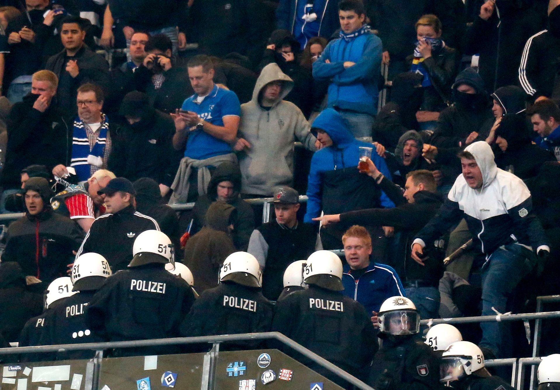 German riot police enters Hamburg SV supporters' block during break of their German Bundesliga first division soccer match against Bayern Munich in Hamburg