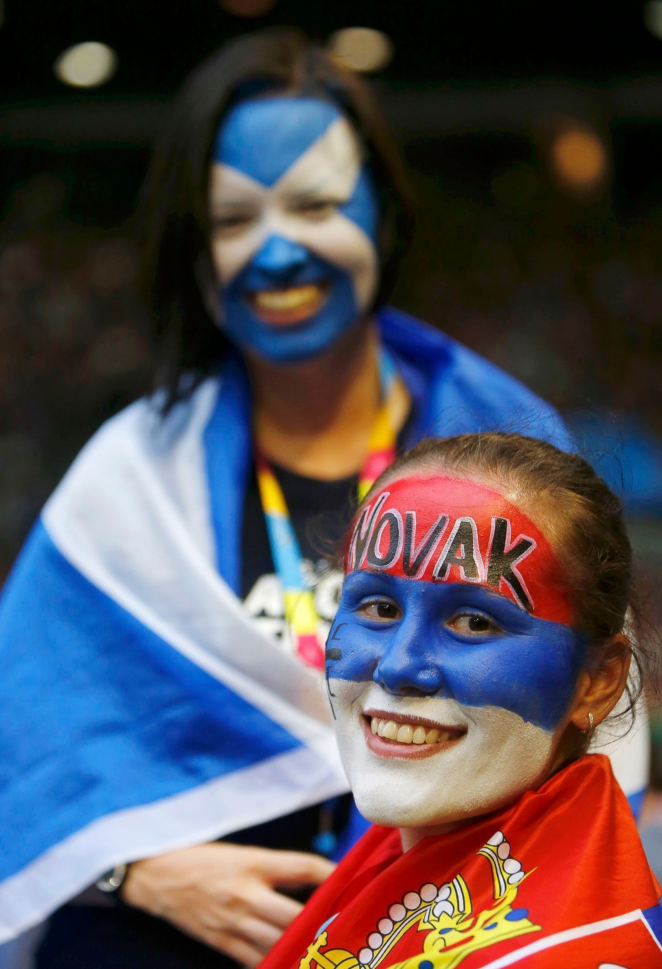 Supporters of Djokovic of Serbia and Murray of Britain smile before the start of the men's singles final match at the Australian Open 2015 tennis tournament in Melbourne