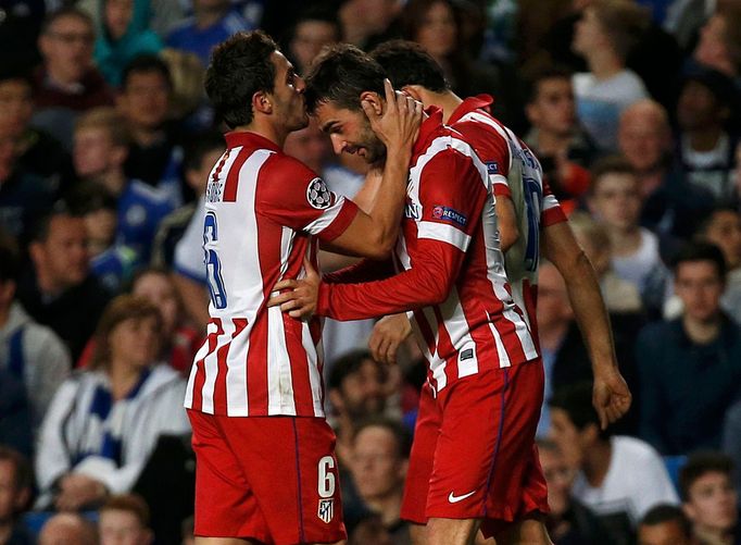 Atletico Madrid's Adrian Lopez (R) celebrates with team mate Koke (L) after scoring the first goal for the team during their Champions League semi-final second leg soccer