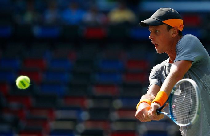 Tomas Berdych of the Czech Republic returns a shot during his men's singles tennis match against Gilles Simon of France at the Shanghai Masters tennis tournament in Shang