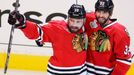 Chicago Blackhawks' Patrick Sharp (L) celebrates his goal against the Boston Bruins with teammate Michal Rozsival during the first period in Game 2 of their NHL Stanley C