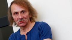 Michel Houellebecq poses during the photo call for the movie &quot;Near Death Experience&quot; at the 71st Venice Film Festival