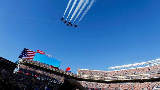 The U.S. Navy Blue Angels demonstration team perform a flight over Levi Stadium before the start of the NFL's Super Bowl 50 football game between the Carolina Panthers an