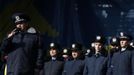 Police officers from Lviv who have arrived to join anti-government protesters appear on a stage in Independence Square in Kiev February 21, 2014.