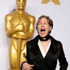 Canonero reacts as she poses with her award for best costume design for her work in the film &quot;The Grand Budapest Hotel&quot;