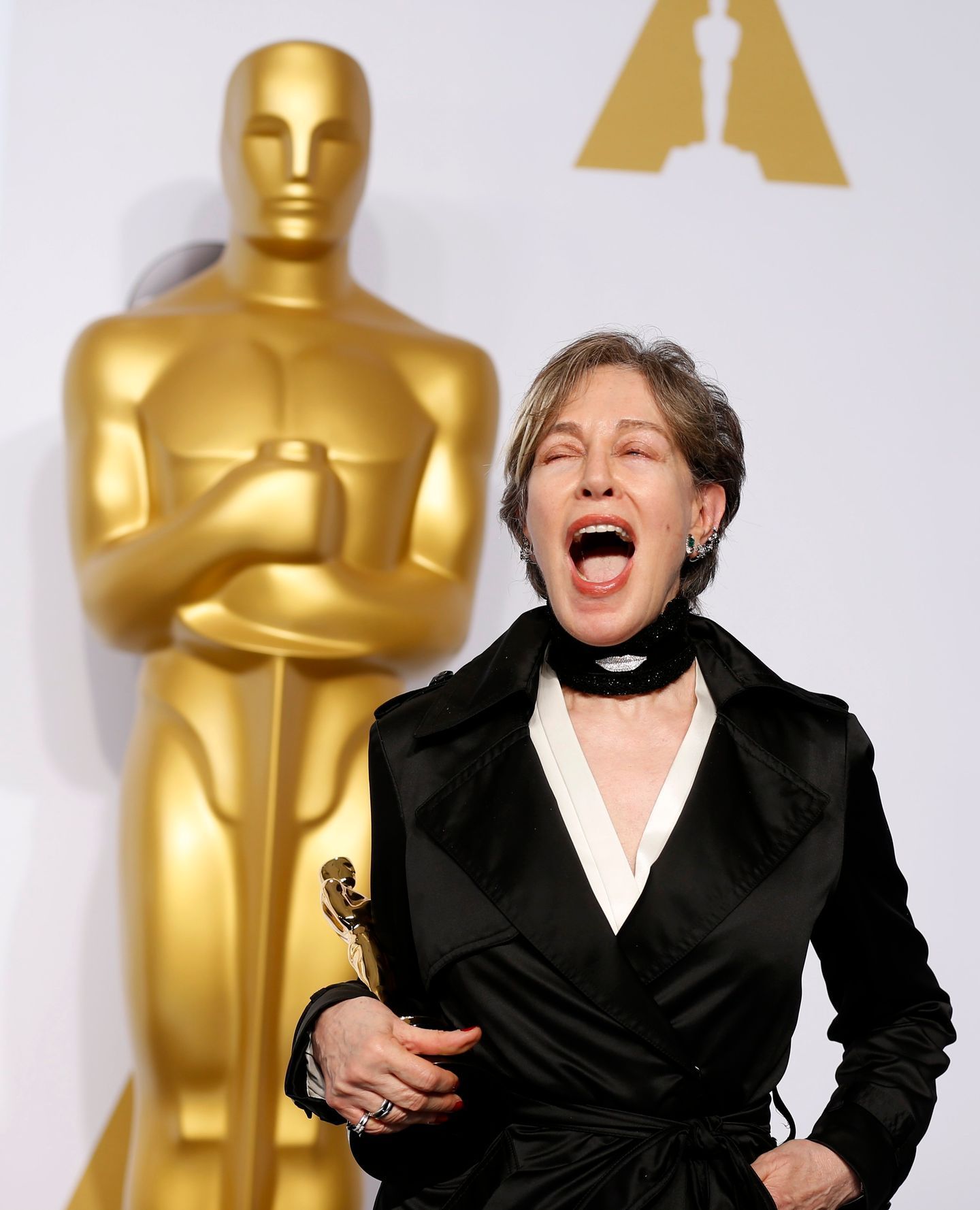 Canonero reacts as she poses with her award for best costume design for her work in the film &quot;The Grand Budapest Hotel&quot;