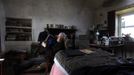 Artist and poet Barry Edgar Pilcher, age 69, poses for a photograph as he plays the saxaphone in his cottage on the Island of Inishfree in County Donegal May 1, 2012. Pilcher is the only inhabitant of the island on which he has lived for the past 20 years. He only leaves the island once a week to collect his pension and buy groceries on the mainland. REUTERS/Cathal McNaughton (IRELAND - Tags: ENTERTAINMENT SOCIETY) Published: Kvě. 2, 2012, 11:23 dop.