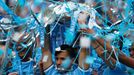 Manchester City's Sergio Aguero celebrates with the English Premier League trophy following their soccer match against West Ham United