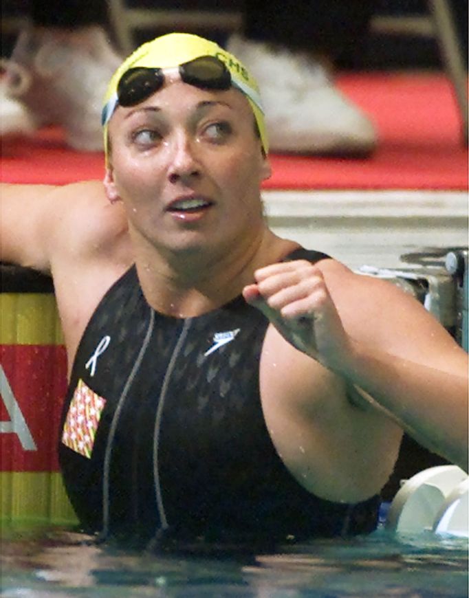 U.S. swimmer Amy Van Dyken raises her fist after her preliminary heat in the 50 meter freestyle event at the U.S. Olympic Team trials in Indianapolis on in this August 15